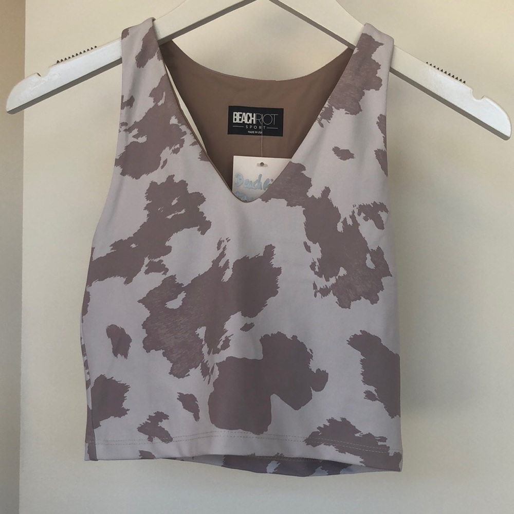 BeachRiot high neck crop top style sports bra with V neck in painted cow print